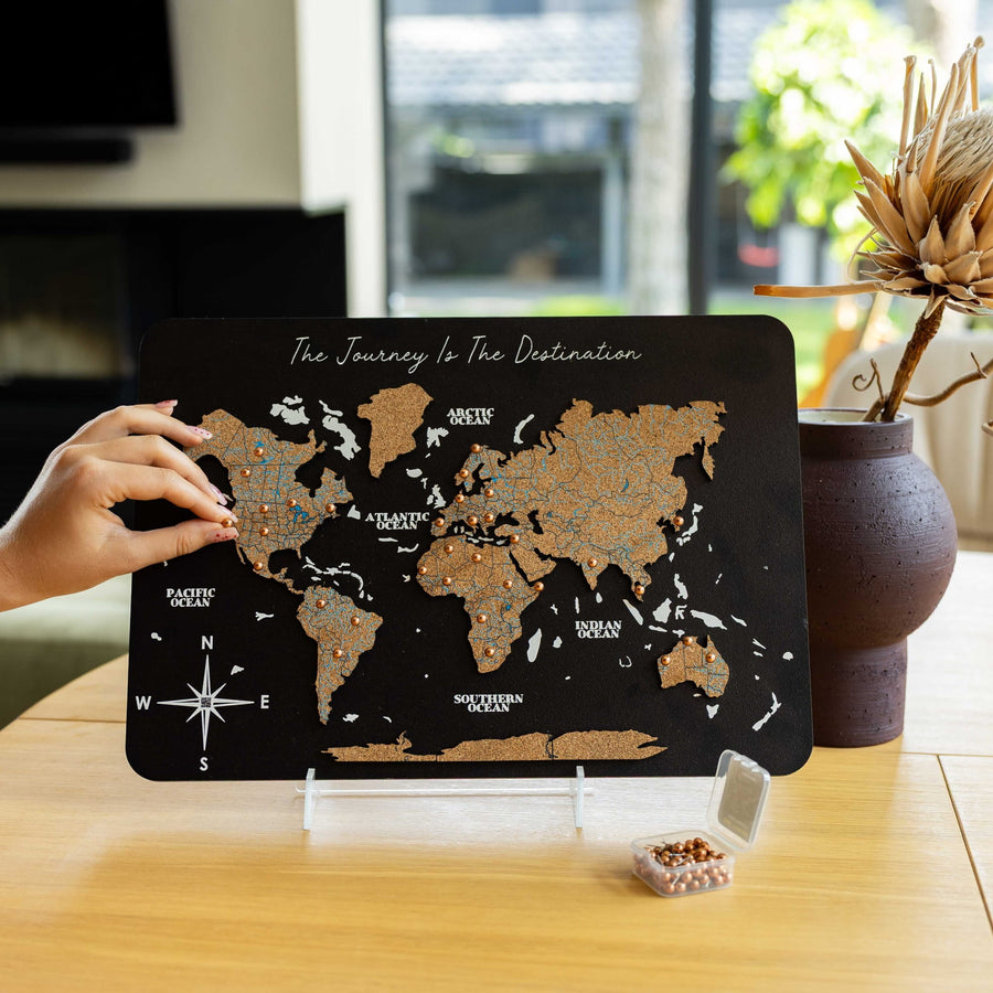 Small cork and wood desktop world map for pinning travel destinations