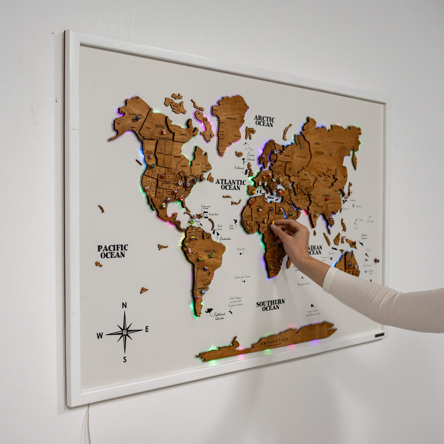 Oak wooden world map mounted on a backlit board panel